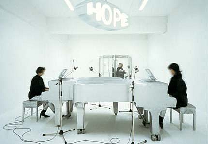 Christian Tomaszewski
Untitled (HOPE), 2002
installation, revolving door and sign, two pianos, two pianists, four microphones, amplifier, cd
Skupturenmuseum Marl, Germany
