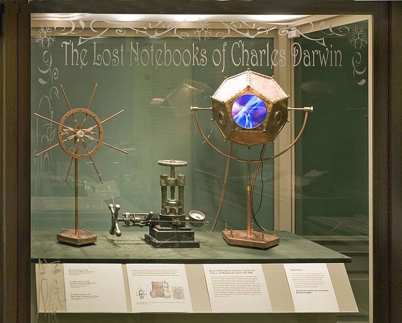 Eve Laramee
Luminous Darwin: The Lost Notebooks of Charles Darwin, 2009
copper, brass, stone marine fossil, glass lens, video, cast iron
Detail of installation of four display cases at the Museum of the American Philosophical Society. Cases shown are "The Memory of Stones" and "Device to Extract Memories from Stones".