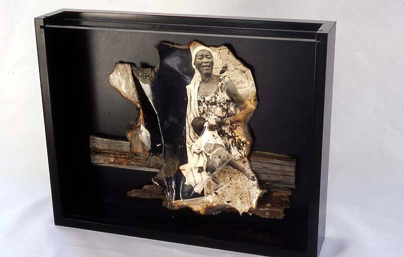 Norma Holt
Cry Africa, 2003
burnt photo, burnt wood adhered to images in wood and glass box, 10 x 6 x 8 inches