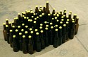 Tony Feher, Untitled (Somethin' Funky)
1997, brown glass bottles, yellow marbles