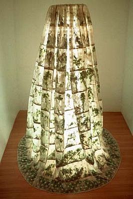 Michele Brody
Culantro En/Agua, 2001
lace sewn into horizontal pockets stuffed with cilantro, lights, steel, 8.5' x 8' diameter