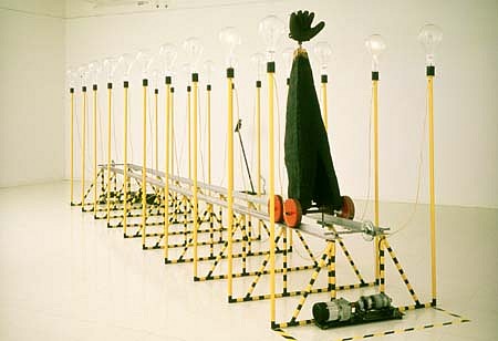 Lawrence Argent
Catch Me If You Can, 1989
mixed media, 25' x 7' x 4'
A Mechanical Device