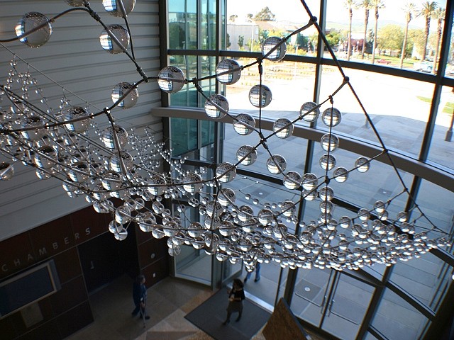 Kana Tanaka
of Capturing a Moment, 2005
glass and stainless steel, 480 x 288 x 432 in.
Solano County Government Center in Fairfield, CA Public Art commissioned by Solano County
