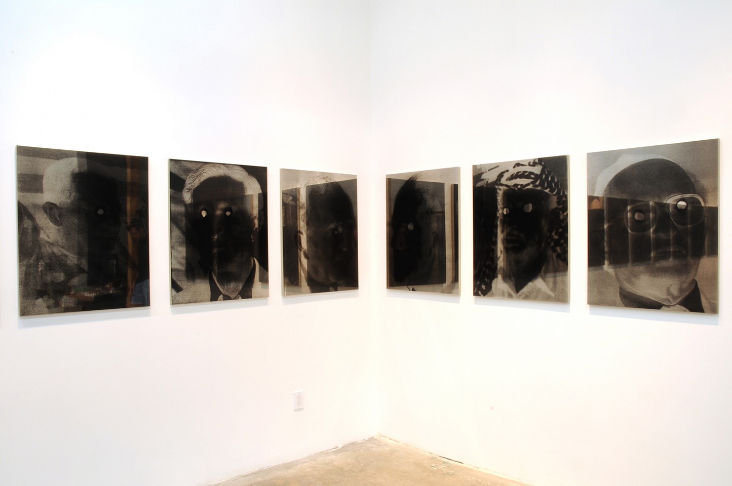 John Jurayj
Untitled (15 Men), 2008-2009
gunpowder screened on mirror polished stainless steel, 30 x 24 in.