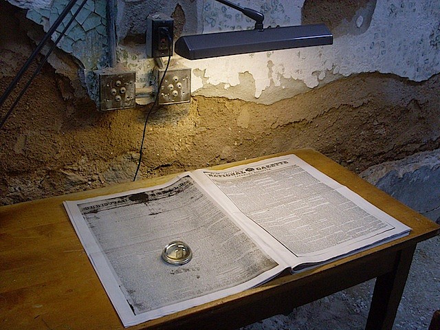 Lisa Bateman
Next Year, 2012-2014
installation - offset print on newsprint broadsheet 141 pages, reading magnifier, chain, furniture, dimensions variable
Eastern State Penitentiary