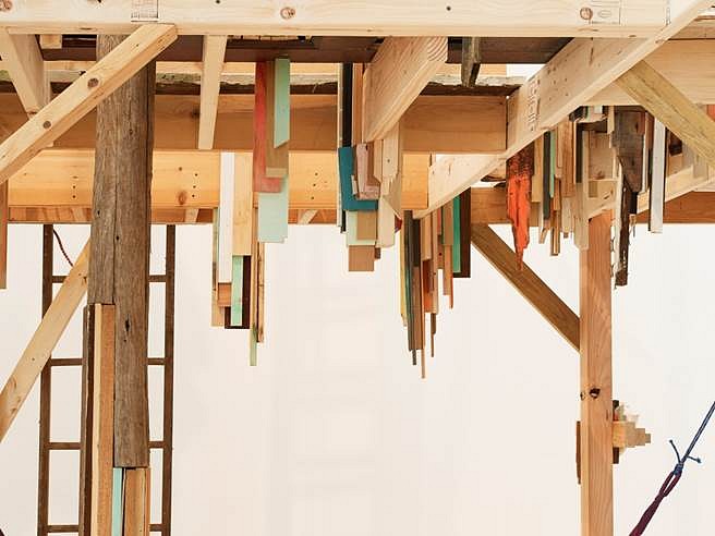 Janelle Iglesias
In High Feather (Ground Level View Under the Structure), 2014
Scavenged wood, doors, pallets, used Christmas Trees, seashells, hammock and miscellaneous scavenged objects and materials, 144 x 144 x 456 in.