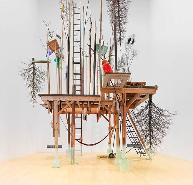 Janelle Iglesias
In High Feather (Ground Entrance View), 2014
Scavenged wood, doors, pallets, used Christmas Trees, seashells, hammock and miscellaneous scavenged objects and materials, 144 x 144 x 456 in.