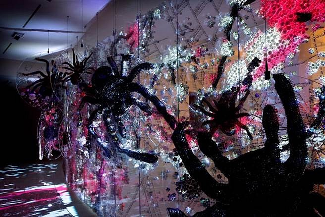 Ran Hwang
The Spider's Stratagem, 2014
Paper buttons, beads, pins on plexiglas and video, 94 x 354 in.