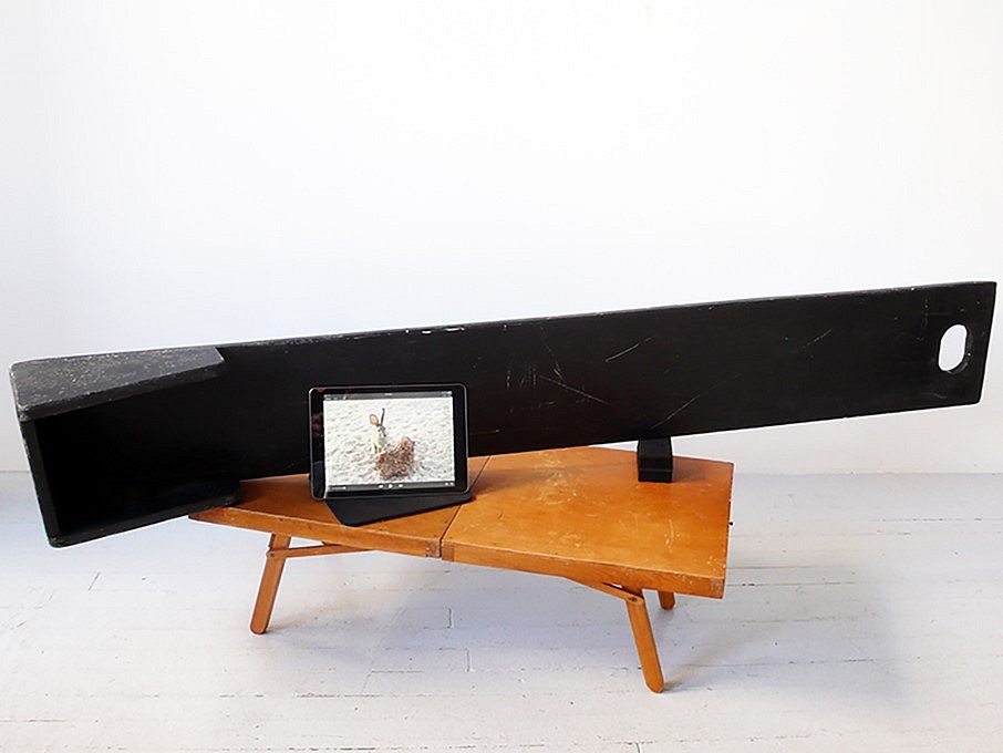 Betty Beaumont
A Whisper Challenging the Order of Things, 2018
wooden table, rubber, felt, painted wooden object, iPad with three videos playing in a loop, 18 1/2 x 62 1/2 x 25 in.