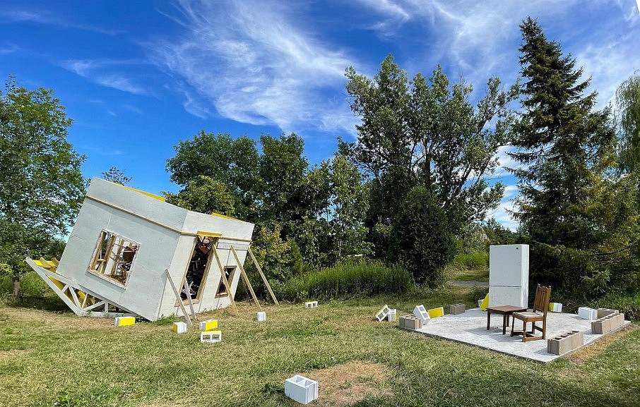 Kim Zumpfe
framing of a space that waits, 2022
concrete slab, glow in the dark surfacing, construction materials, cast-off chairs, paint, cinder blocks, concrete, refrigerator, table, chairs, House is 12 x 18 x 20 feet
Slab is 12 x 12 x 6 feet